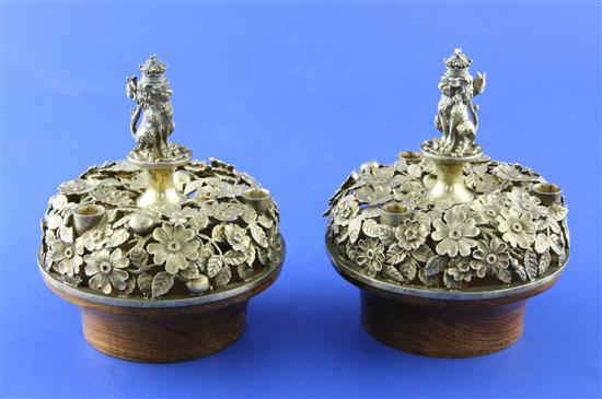 A pair of limited edition silver-gilt Bowes-Lyon taper holders, Hector Miller for Aurum 1983 (the Queen Mothers 60 years of service)